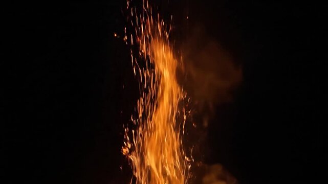 Bright Orange Sparks Falling on Black Background