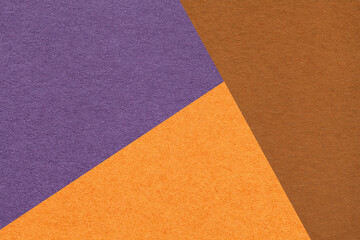 Fototapeta premium Geometric triangular orange brown violet textured paper background with copy space for banner template