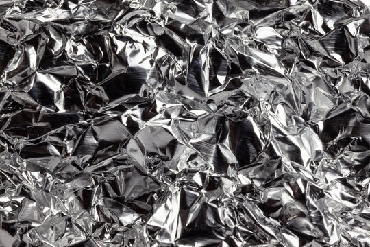 Crushed aluminum foil macro background hi density
