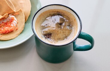 cup of coffee with crispy crepe