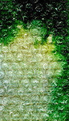 Experimental abstract artwork &mdash; bubble wrap texture, green watercolor in emerald and swamp tones. Layered mixed media composition with strong contrast for music album covers, vinyl sleeves, posters.