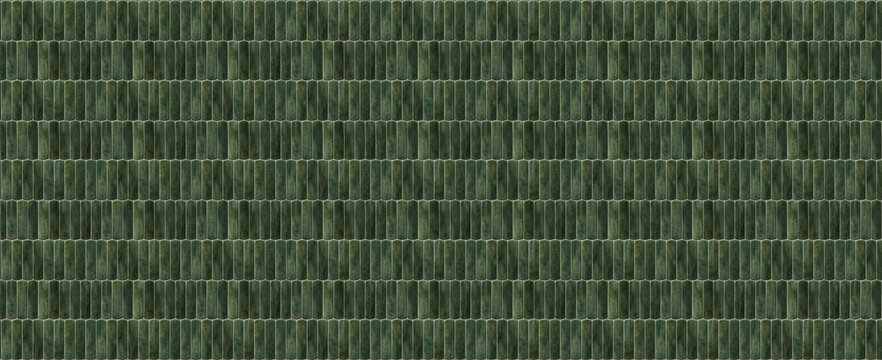 Dark green ceramic finger tiles texture background with vertical pill shaped mosaic pattern for interior wall design and architectural surfaces