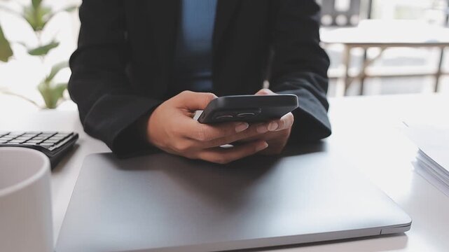 Young casual Businessman holding and using smartphone for sms messages, hipster man typing touchscreen cell phone in the cafe. business, lifestyle, technology and Social media network concept