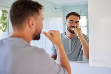 Man brushing teeth during morning routine