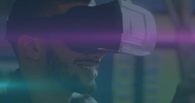 Animation of blue and pink light trails moving over man wearing vr headset