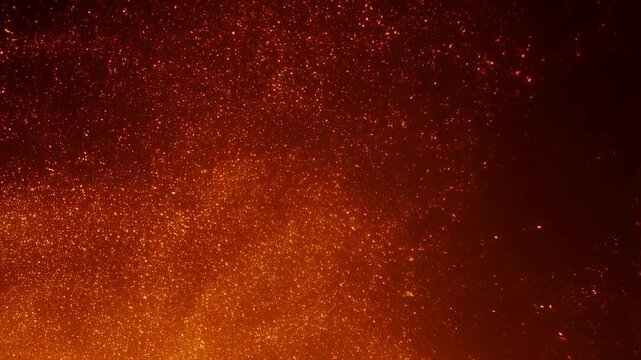 Glowing embers and sparks floating in the air, creating a mesmerizing visual effect. Ideal for backgrounds in creative projects and conveying warmth and energy