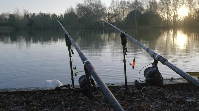 Serene evening fishing at Bilingford Lake with rods in calm water
