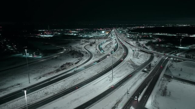 Aerial view of snowy highway 403 and QEW in Mississauga at night