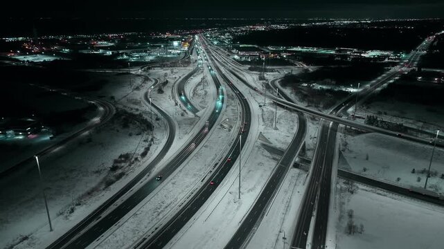 Night aerial of snowy highway intersection in Mississauga, Ontario