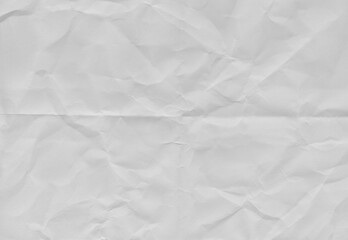 Obraz premium High resolution crumpled white paper texture with visible wrinkles and creases. Abstract vintage paper background suitable for design, templates and overlays.