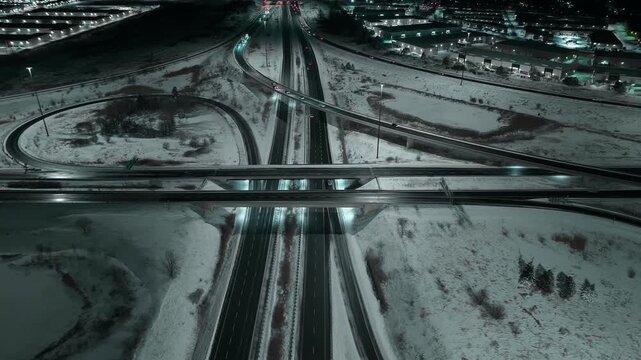Night aerial of snowy highways 403 and 407 in Mississauga, Ontario