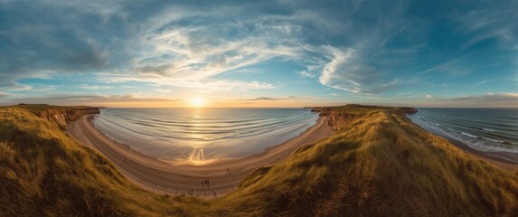 Obraz premium Sunset over the expansive beach and dunes in a panoramic shot