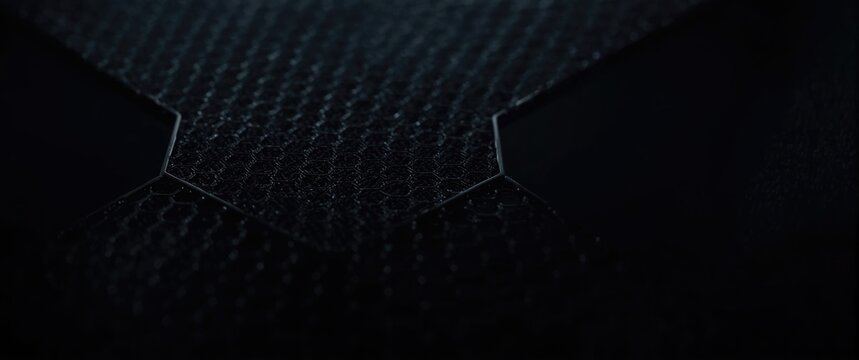 Industrial mesh backdrop featuring black iron and plastic hexagonal pattern panorama