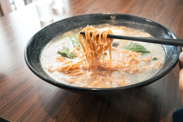 Taiwanese pot style noodles, nabeyaki yi mein with egg and vegetables.
