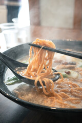 Taiwanese pot style noodles, nabeyaki yi mein with egg and vegetables.
