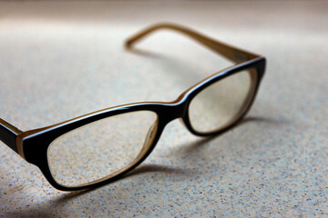 Eyeglasses on table close up