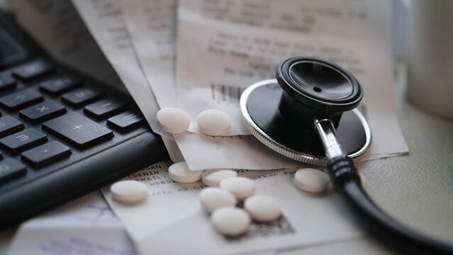 Pile of unpaid expensive hospital bills.