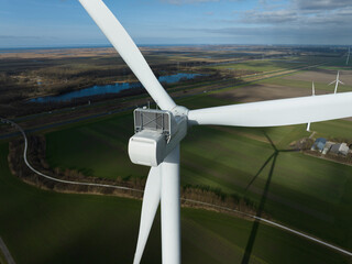 Wind turbine generating clean energy in agricultural landscape