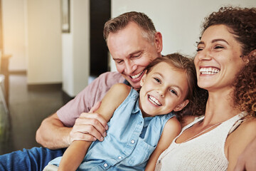 Fototapeta premium Laughing, smile and love with family on sofa for bonding, comfortable and support. Happiness, funny joke and connection with parents and child in living room of home for weekend break and portrait