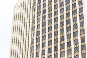 Fototapeta premium business facade concrete facade huge external side building high rise skyscraper Eastern Europe aesthetic background perspective point