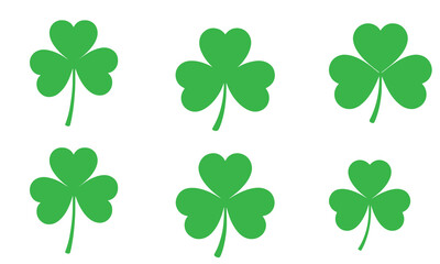 Six green shamrock clovers on a white background, symbolizing luck.
