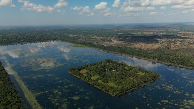 A drone slowly pulls back from Neak Poan Temple island in Angkor Thom, Siem Reap