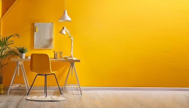 a bright yellow room with a desk and chair