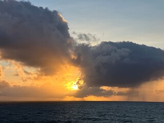 Golden sunset over the Atlantic Ocean with dramatic clouds near O Rosal, Galicia, Spain, January 2025