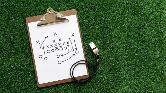 Coach clipboard with tactical game plan diagram and whistle