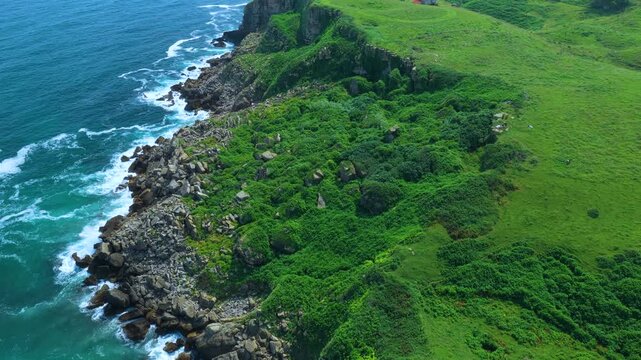 Aerial view from a drone of the coastline near Punta Ballota in the municipality of Suances. Cantabrian Sea. Cantabria. Spain. Europe