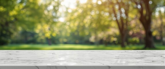 Empty white marble table surface with a blurred park tree and bokeh lights in background, display template for your design, advertising banner for products, panoramic perspective