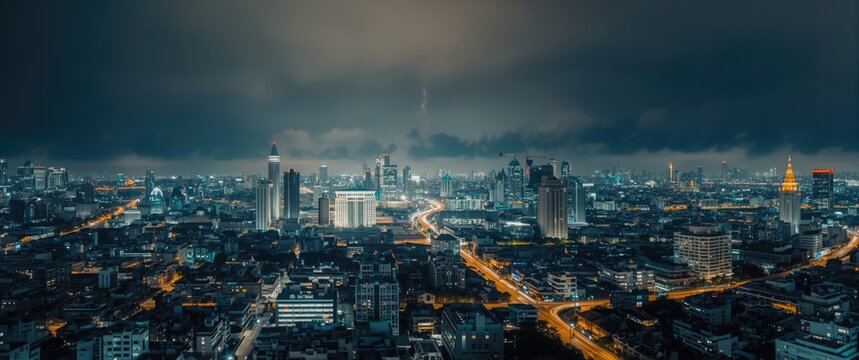 Bangkok cityscape at night from above, highlighting its financial district