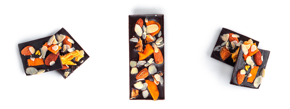 Raw chocolate with dried fruits and nuts on a white background. High quality photo