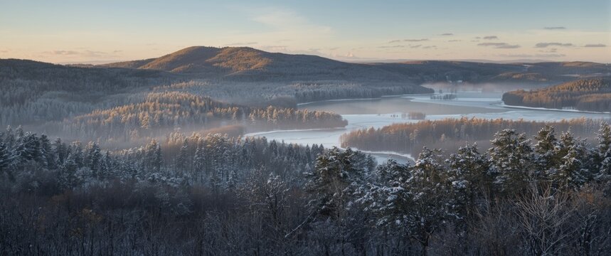 Czech Republic winter scene featuring a forest and Lovos hill in the Bohemian Highlands (Ceske Stredohori)