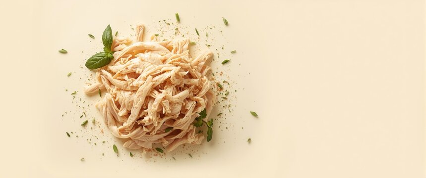 Stack of white rice and shredded chicken meat