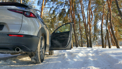 Wide Open Door Of A Car On A Winter Suburban Road. Winter Car Travel Stock Image 
