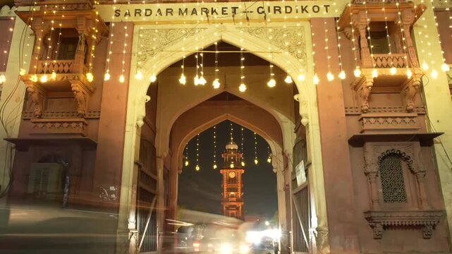 Timelapse of Ghanta Ghar clock tower capturing vibrant night traffic in Jodhpur, India