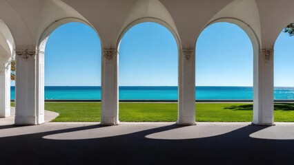 Naklejka premium White arched colonnade overlooking a green lawn and turquoise sea under a clear blue sky. Concept White arched colonnade, Lush green lawn, Turquoise sea, Clear blue sky