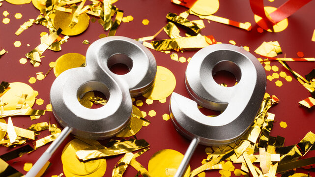 Number 89 celebration birthday digit on Red festive with confetti background. eighty-nine year birthday. concept of birthday, anniversary and date.