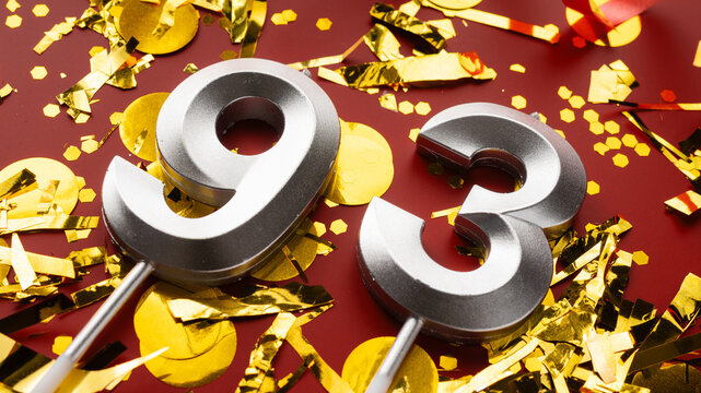 Number 93 celebration birthday digit on Red festive with confetti background. ninety-three year birthday. concept of birthday, anniversary and date.