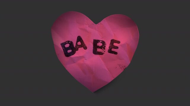A stop motion style peeling paper sticker with cheeky caption in the shape of a love heart with alpha for easy overlay and drag and drop.