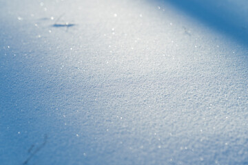 Obraz premium Macro snow crystals shimmering under cool light, close view of granular frost and microtexture, ethereal sparkle and subtle shadows conveying crisp cold and meditative stillness