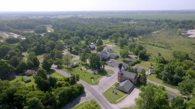Neighborhood homes in Newaygo, Michigan with drone video moving in.