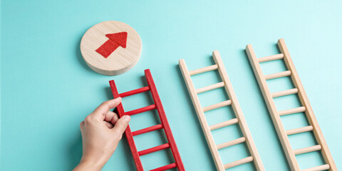 Concept of growth and the path to success with a hand on the red ladder and an upward pointing arrow