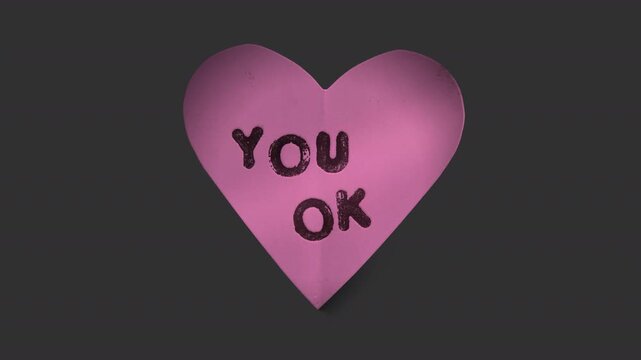 A stop motion style peeling paper sticker with cheeky caption in the shape of a love heart with alpha for easy overlay and drag and drop.