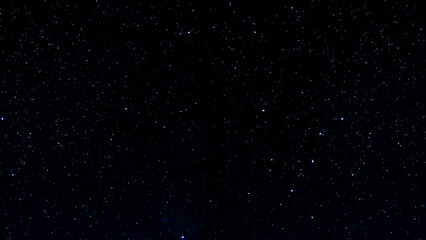 Abstract night sky with falling stars and drifting snowflakes in a dark cosmic starfield animation © Hameed-Ahmed