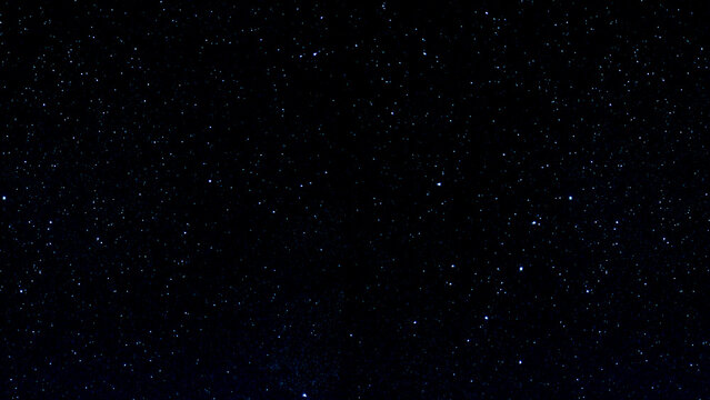 Abstract night sky with falling stars and drifting snowflakes in a dark cosmic starfield animation