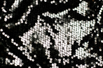 Beautiful black sequin fabric as background, closeup