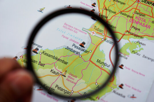 view of Garuda Wisnu Kencana (GWK), Bali Island, Indonesia on a geographical map, seen using a magnifying glass