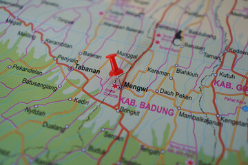 Naklejka premium view of Mengwi, Badung Regency, Bali Island, Indonesia on a geographical map, marked with red pushpin